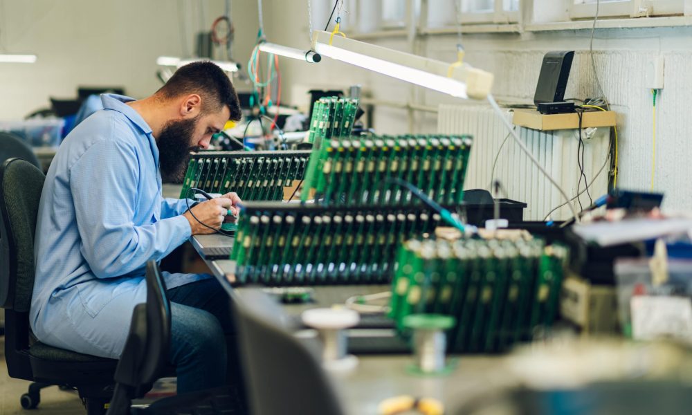 electronics-engineer-working-in-a-workshop-with-ti-2025-04-01-13-22-11-utc-min